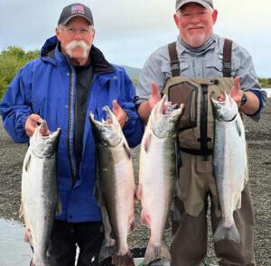 Clients of RiverRise Fishing Guides with their limits of Silver Salmon