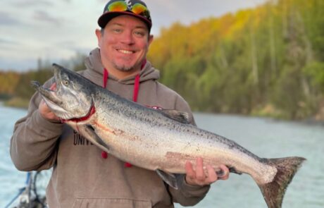 A RiverRise Fishing Guides client with a King Salmon on a recent fishing trip