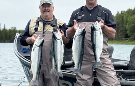 Clients of RiverRise Fishing Guides with a limit of Sockeye Salmon from a recent fishing trip