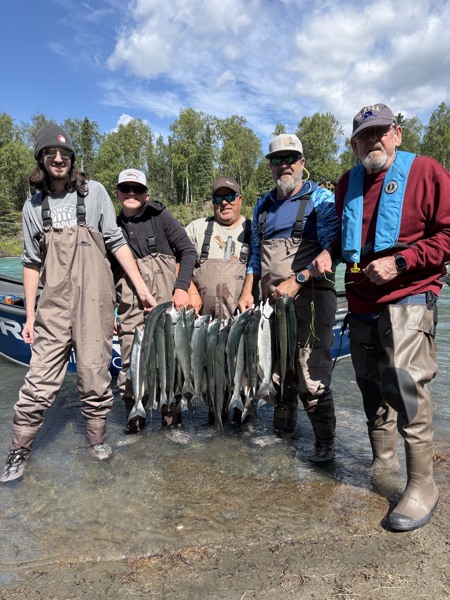 RiverRise Fishing Guides clients holding a limit of sockeye salmon on the Kenai River