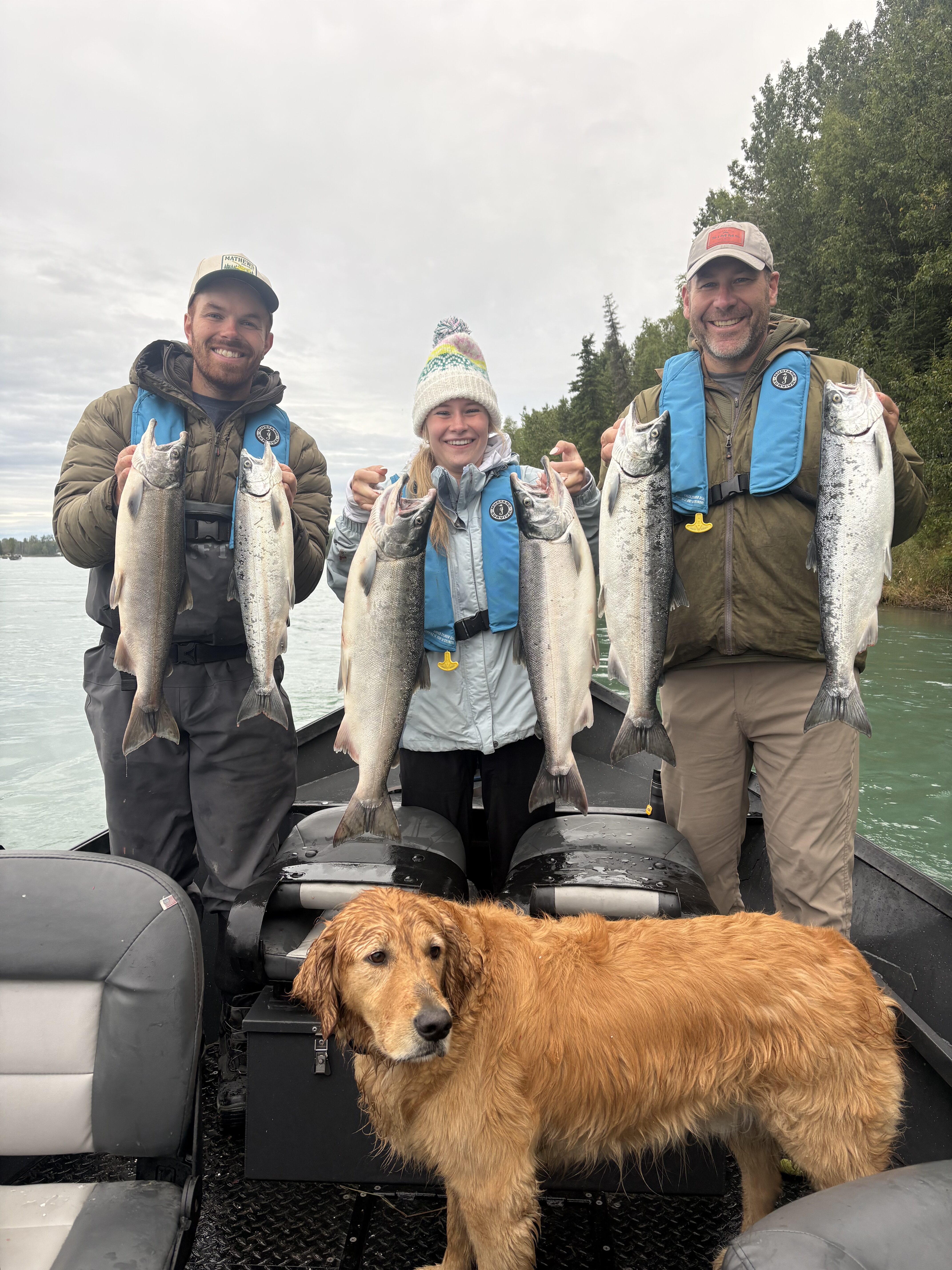 Clients of RiverRise Fishing Guides holding limits of SIlver Salmon.