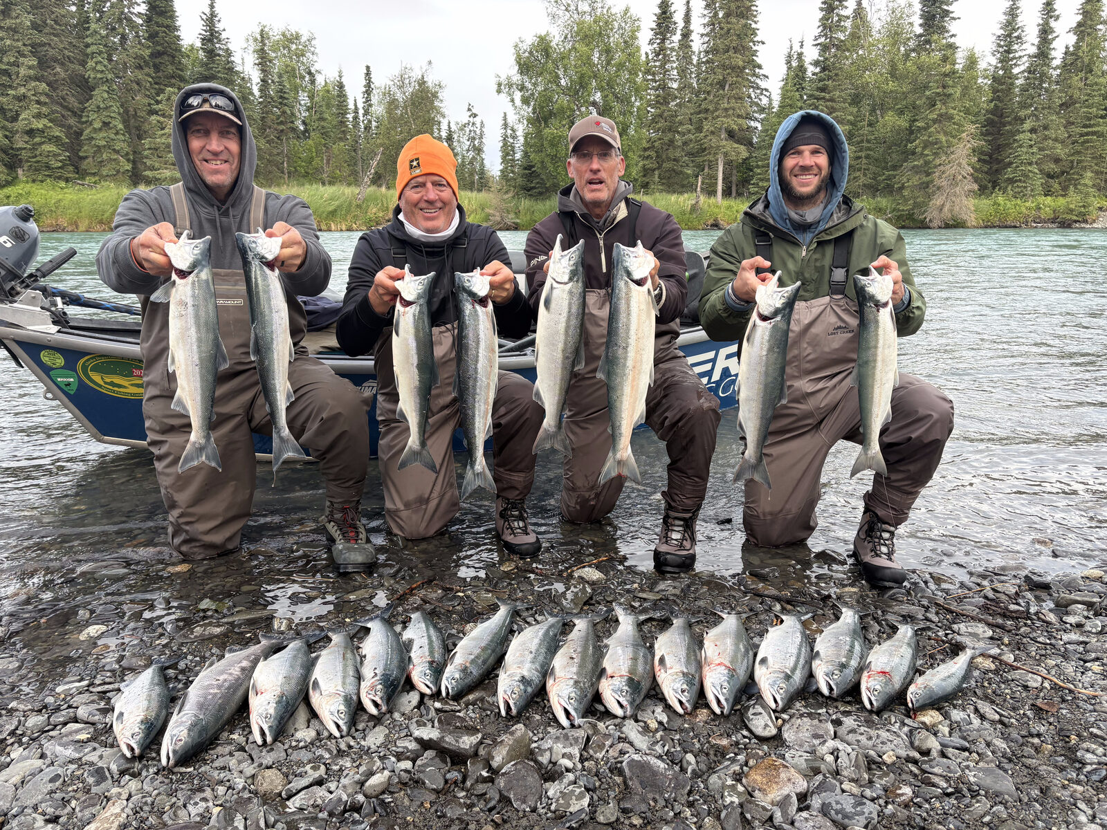 RiverRise clients holding up silvers on the Kenai River